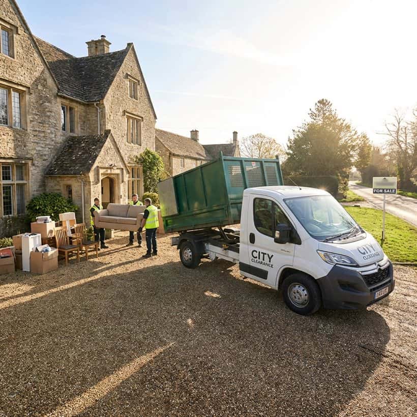 City Clearance house clearance team and branded vehicle outside a property
